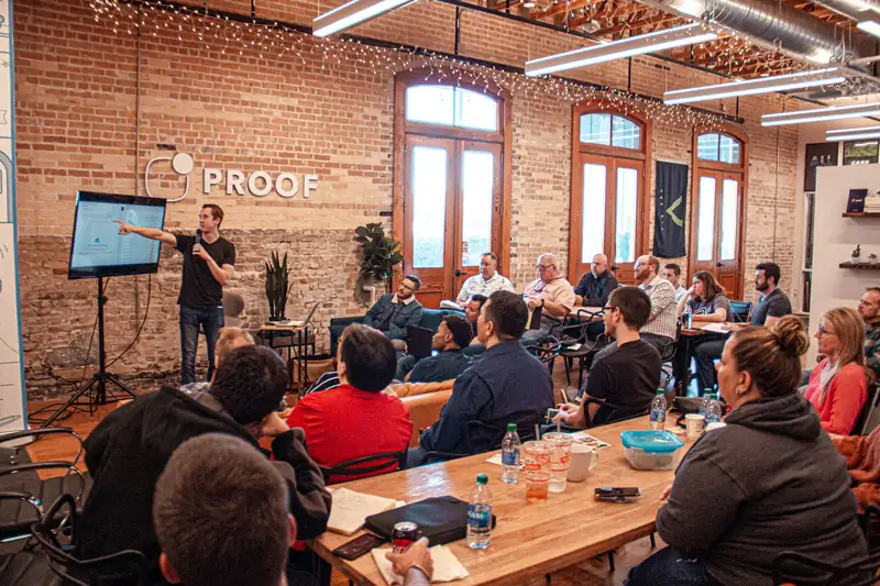 A consultant presenting a workshop to a room of marketers